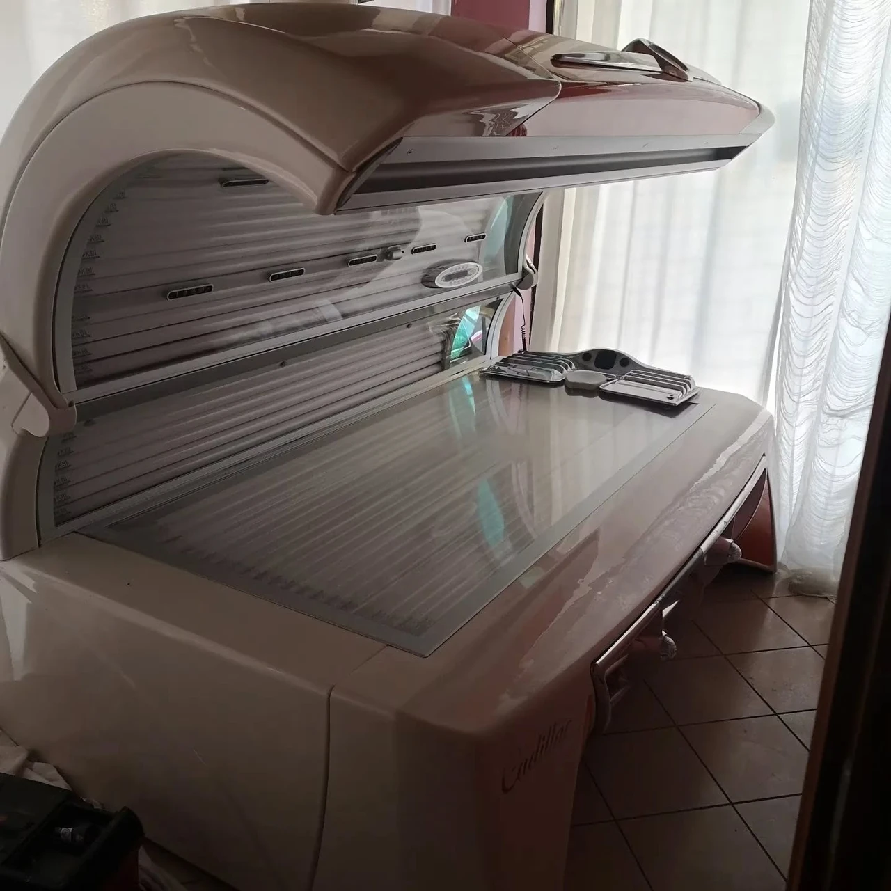 KBL megaSun Cadillac horizontal sunbed with the canopy raised during technical work in Italy